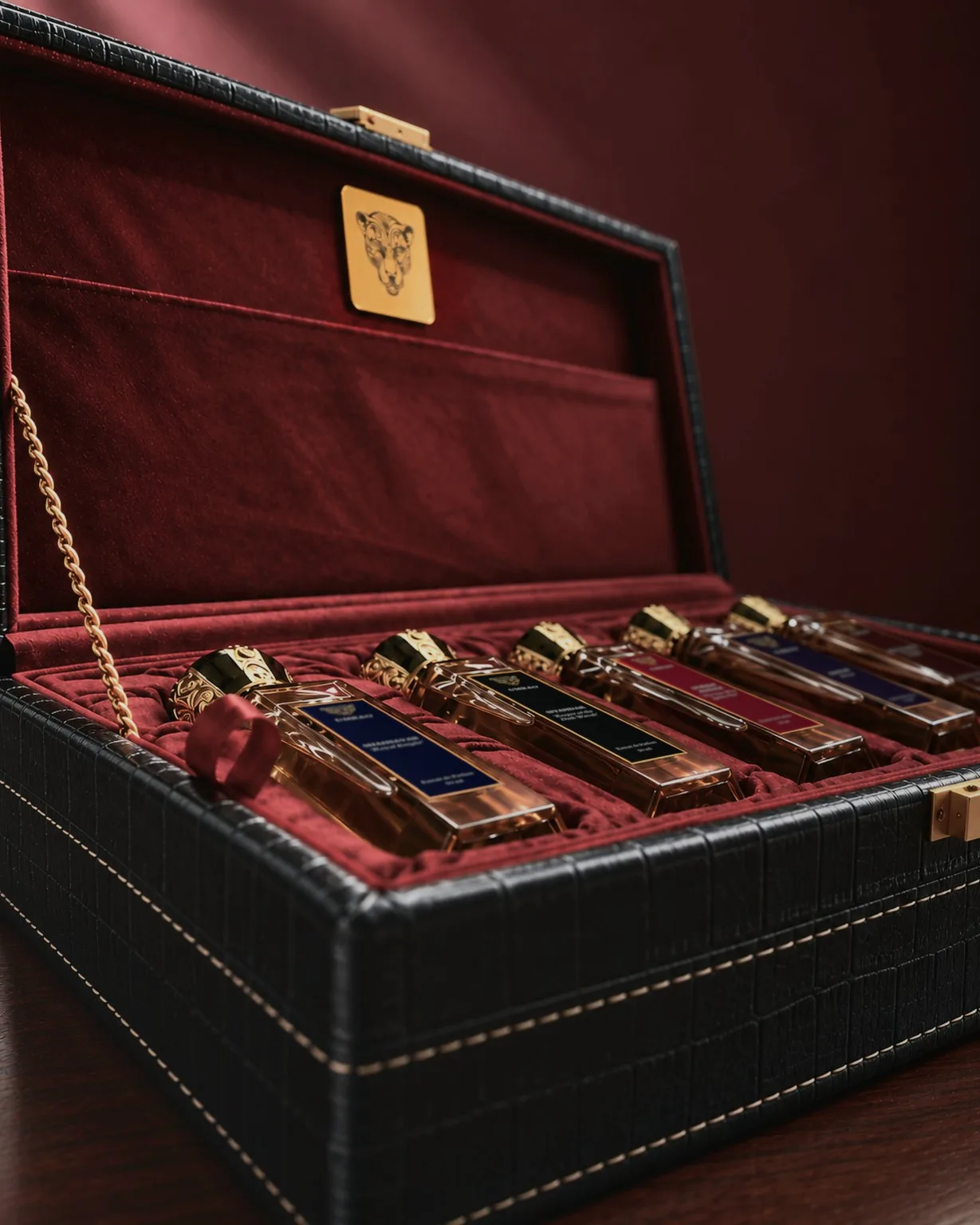 An open Umrao coffret holding five bottles on red velvet