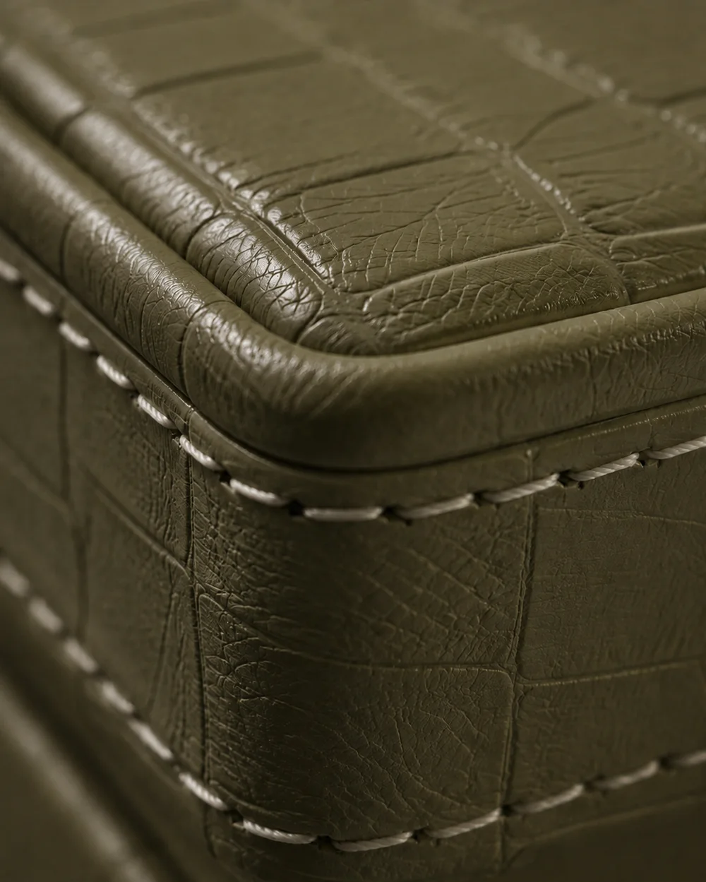 Zaitoon Olive, a crocodile-grain hide, with contrasting stitching